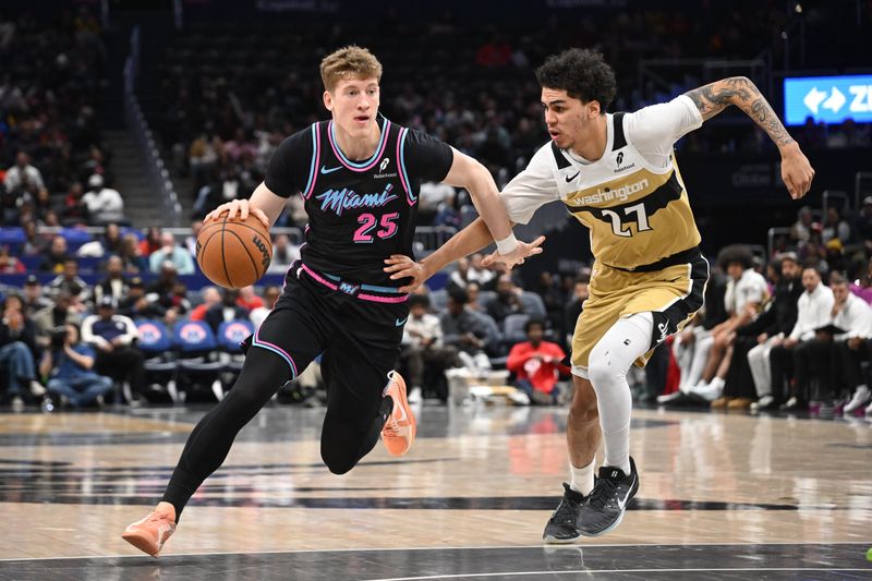Feb 8, 2026; Washington, District of Columbia, USA; Miami Heat guard Kasparas Jakucionis (25) attempts to drive past Washington Wizards guard Will Riley (27) during the first quarter at Capital One Arena. Mandatory Credit: Rafael Suanes-Imagn Images