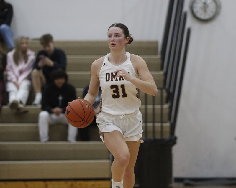 Omro's Ava Koch dribbles up the court against Winnebago Lutheran at Omro High School on Thursday, Feb. 19, 2026. Winnebago Lutheran beat Omro by a score of 59-53.