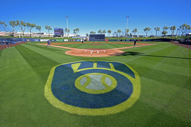 Feb 21, 2026; Phoenix, Arizona, USA; Grounds crew prep the field for the spring training game between the Milwaukee Brewers and the Cleveland Guardians at American Family Fields of Phoenix. Mandatory Credit: Jayne Kamin-Oncea-Imagn Images