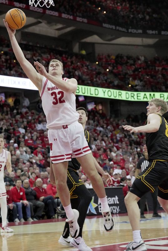 Wisconsin forward Aleksas Bieliauskas (32) scores during the second half of the game Sunday, February 22, 2026 at the Kohl Center in Madison, Wisconsin. Wisconsin beat Iowa 84-71.