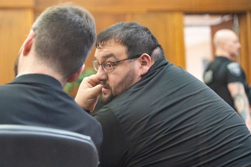 Demitrios Visvardis, a former paraprofessional at Riverside High School, speaks to his attorney before pleading guilty to one count of battery, a Class A misdemeanor, at the Milwaukee County Safety Building on Feb. 23, 2026, in Milwaukee, Wisconsin. - Angelica Edwards / The Milwaukee Journal Sentinel