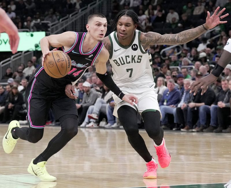 Former Heat guard Tyler Herro drives past future Bucks teammate Kevin Porter Jr. during the first half on Tuesday, Feb. 24, at Fiserv Forum in Milwaukee. Mark Hoffman/Milwaukee Journal Sentinel