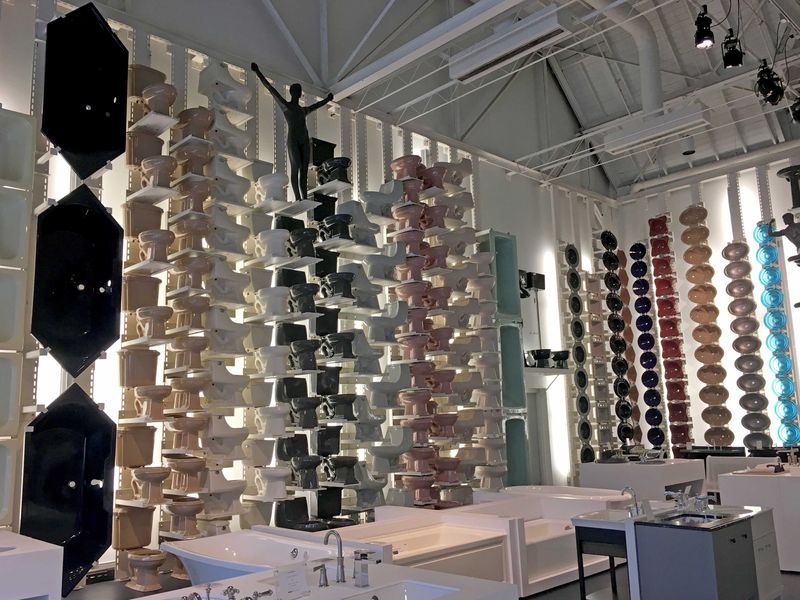 The Kohler Showroom at 101 Upper Rd, Kohler, WI, features a wall of toilets and other company designs.