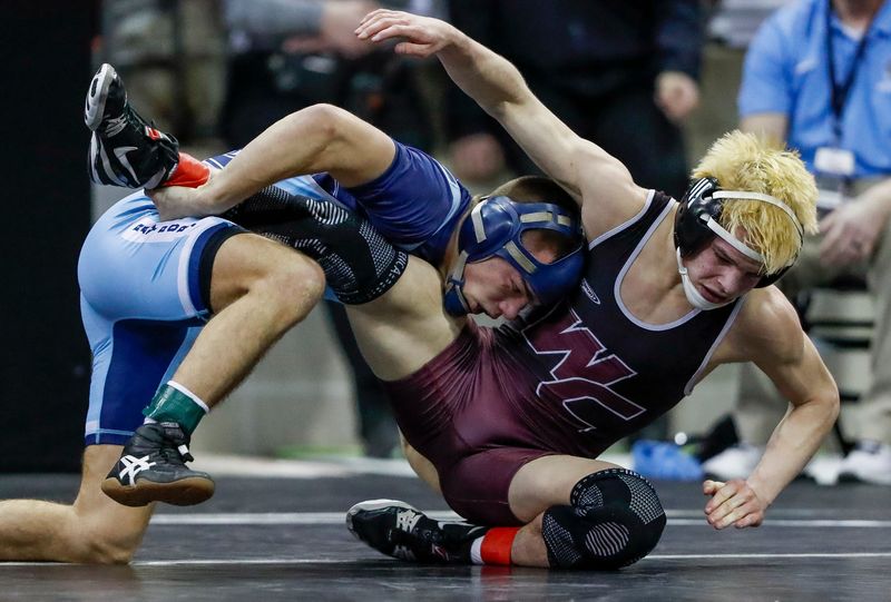 Bay Port High School's Alois Schlumpf takes a shot against Westosha Central High School's Ashton Scheele in a Division 1 132-pound semifinal match during the 2026 WIAA State Individual Wrestling Tournament on Friday, February 27, 2026, at the Kohl Center in Madison, Wis. 
Tork Mason/USA TODAY NETWORK-Wisconsin