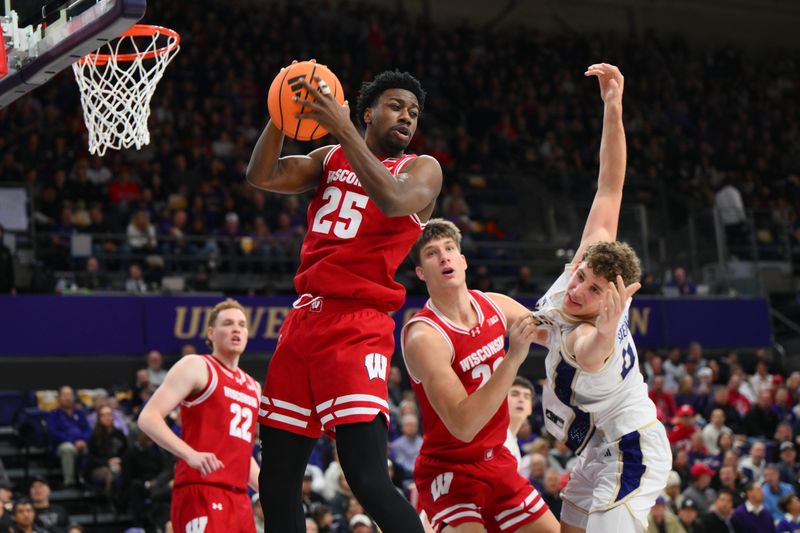 Feb 28, 2026; Seattle, Washington, USA; Wisconsin Badgers guard John Blackwell (25) rebounds the ball against the Washington Huskies during the first half at Alaska Airlines Arena at Hec Edmundson Pavilion. Mandatory Credit: Steven Bisig-Imagn Images