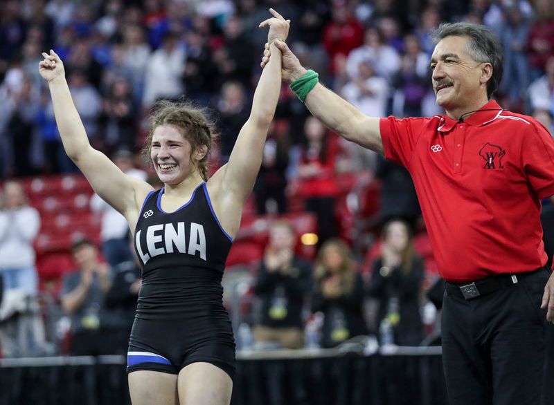 Lena's Taylor Whiting reacts after defeating Manitowoc Lutheran's Emjay Neumann in the girls 114-pound championship match of the WIAA state tournament Feb. 28 at the Kohl Center in Madison. Whiting won the match by decision, 10-5, to become the first girl to win four state wrestling titles in WIAA history.