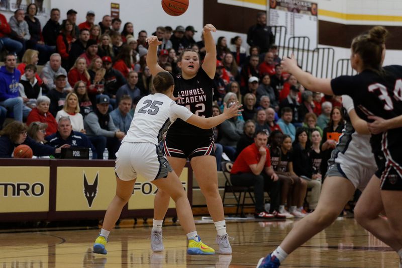Lourdes Academy's Sarah Hafemeister makes a pass against Valley Christian at Omro High School on Saturday, Feb. 28, 2026. Lourdes Academy defeated Valley Christian 48-41.