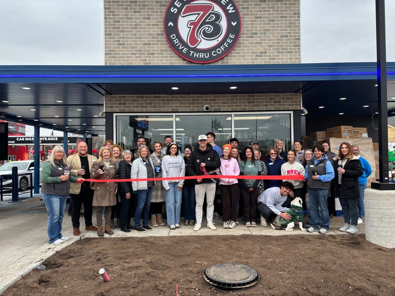 Members of the Oshkosh Chamber and Oshkosh Area Humane Society celebrating 7 Brew ribbon-cutting ceremony.