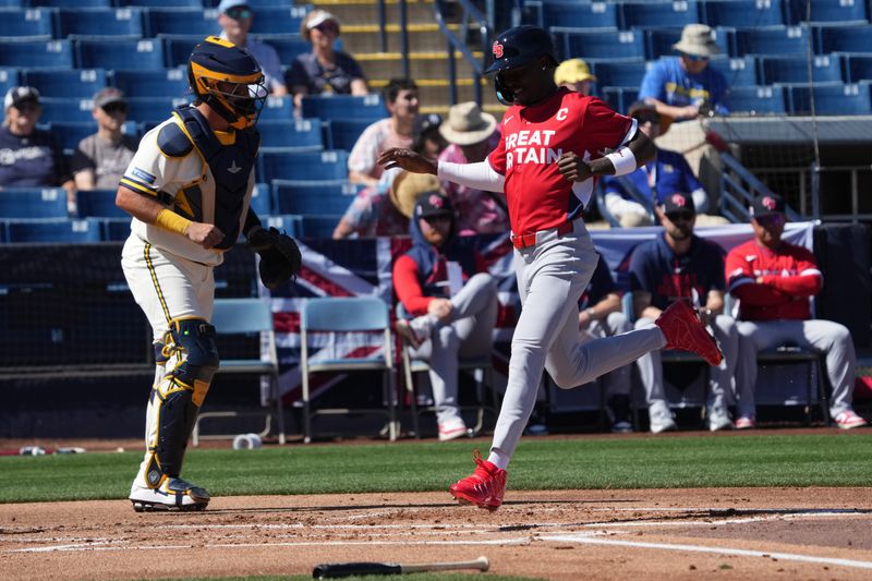 Great Britain second baseman Jazz Chisholm Jr. scores a run against the Brewers in the first inning on Tuesday, March 3 at the American Family Fields of Phoenix.