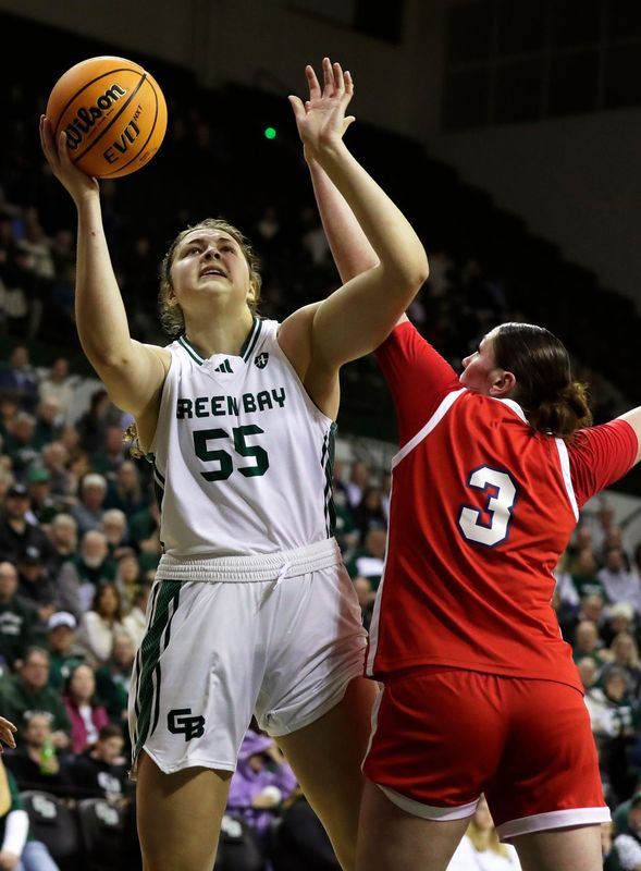 UW-Green Bay's Meghan Schultz shoots against Detroit.