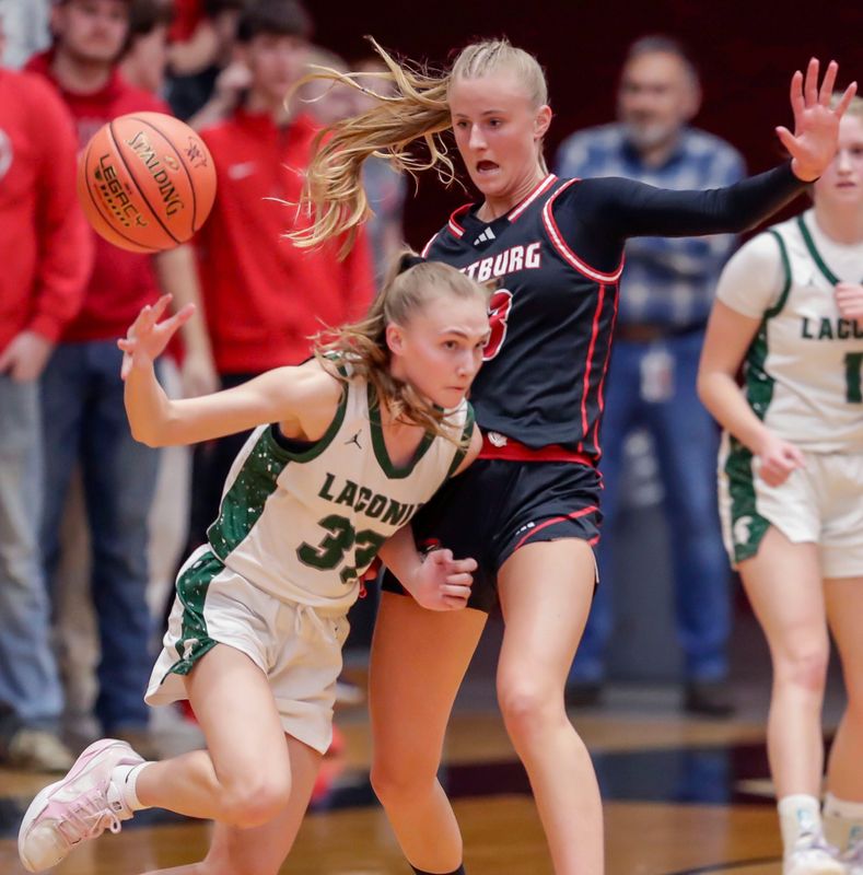 Laconia’s Mylee Redman (33) drives the ball near Oostburg’s Kinsley Ketterhagen during the Div. 3 WIAA Sectional 3 semi-final, right, Thursday, March 5, 2026, in Sheboygan, Wis.