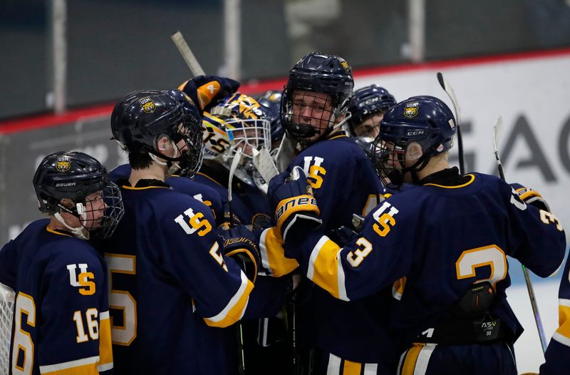 University School of Milwaukee Wildcats’ players embrace each other after losing to the Edgewood Crusaders during their WIAA Division 1 boys semifinal hockey game Friday, March 6, 2026, at Bob Suter’s LEGACY20 Arena in Middleton, Wisconsin.