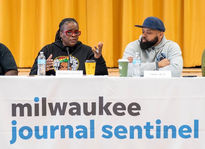 Michelle Bryant, left, host of "Say Something Real," and Eddie Silas, right, co-owner of Prolific Arms, participate in a panel during the "Behind the Gun: Milwaukee Gun Owners Safety Summit," hosted by the Milwaukee Journal Sentinel on March 7, 2026, at the Prince Hall Masonic Temple in Milwaukee, Wisconsin.