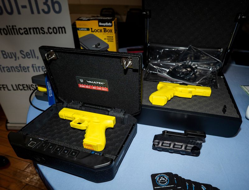 A firearm lock box is displayed during the "Behind the Gun: Milwaukee Gun Owners Safety Summit," hosted by the Milwaukee Journal Sentinel on March 7, 2026, at the Prince Hall Masonic Temple in Milwaukee, Wisconsin.