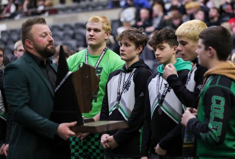Coleman wrestlers receive the runner-up trophy after the WIAA Division 2 championship match March 7 at the La Crosse Center.