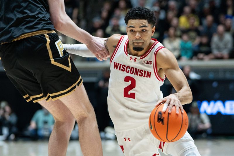 Mar 7, 2026; West Lafayette, Indiana, USA; Wisconsin Badgers guard Nick Boyd (2) drives to the basket during the first half against the Purdue Boilermakers at Mackey Arena. Mandatory Credit: Jacob Musselman-Imagn Images
