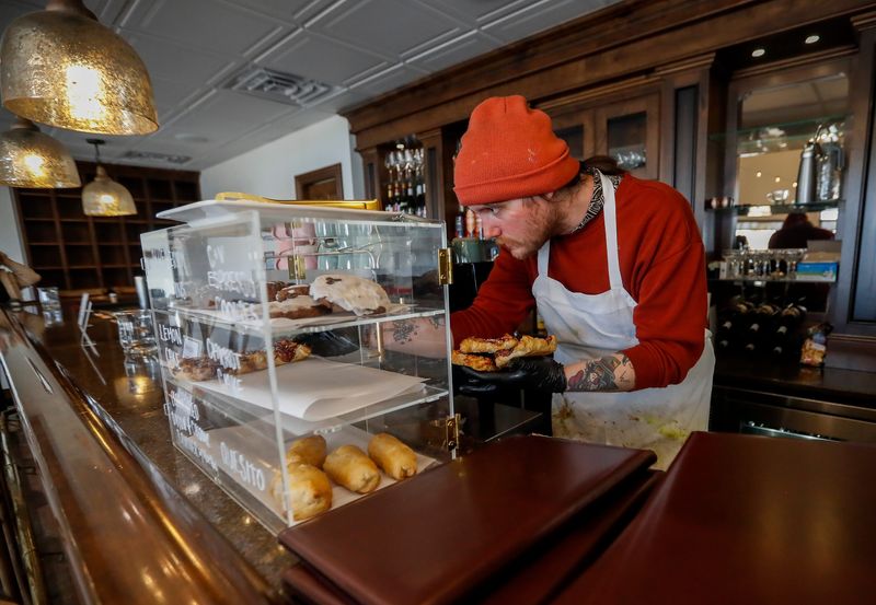 Collin Catalano restocks baked goods on Tuesday, March 10, 2026, at Bay House Landing and il Bar Coffeehouse and Bistro in Scott, Wis. The space, 3597 Bay Settlement Rd, houses both businesses; Bay House Landing serves as an event venue, which Shannon Richardson owns, while Monica Bales owns il Bar Coffeehouse and Bistro.
Tork Mason/USA TODAY NETWORK-Wisconsin