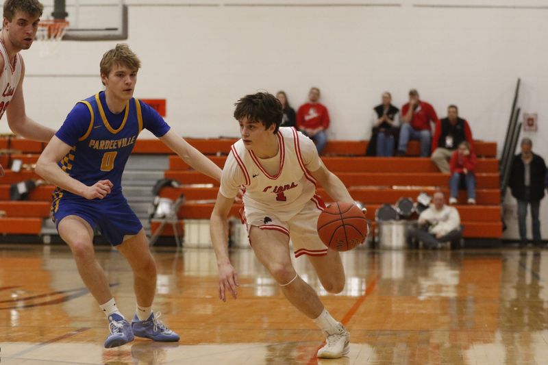 Lomira's Jackson Bloohm drives to the basket against Pardeeville in a 67-54 sectional semifinal win at Portage High School on Wednesday, March 11, 2026.