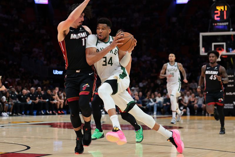 Bucks forward Giannis Antetokounmpo (34) drives to the basket against Heat forward Jaime Jaquez Jr. (11) during the second quarter on Thursday, March 12 at Kaseya Center in Miami.