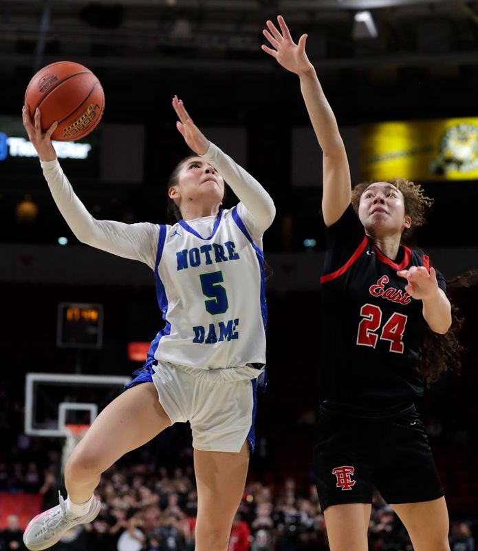 Green Bay Notre Dame senior guard Destiny Webster (5) goes in for a layup during a WIAA Division 1 girls basketball semifinal against Wauwatosa East on March 13 at the Resch Center.
