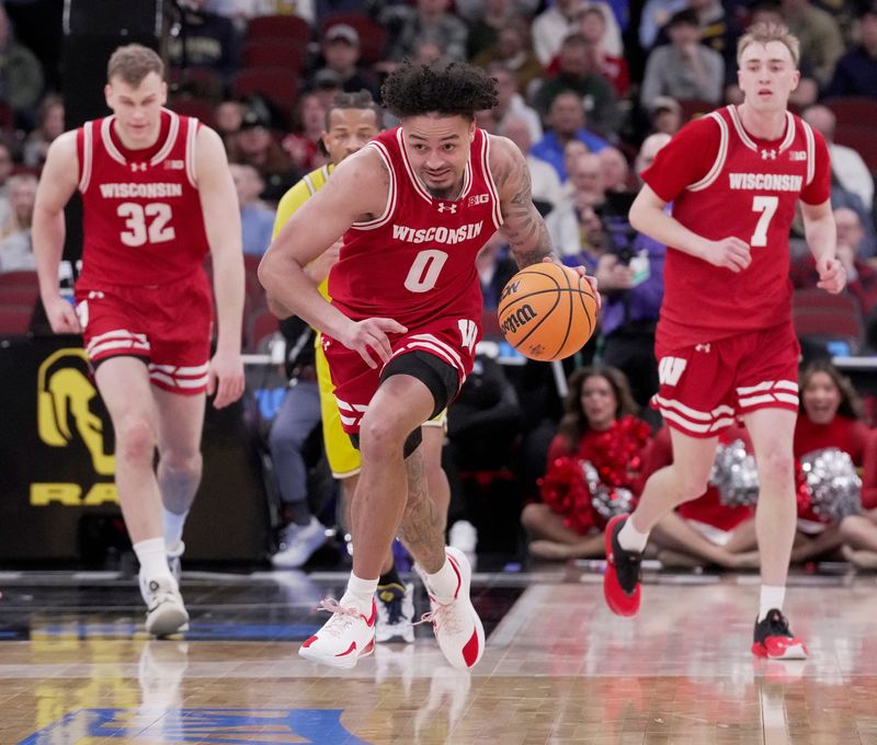 Wisconsin guard Braeden Carrington (0) runs down court on a fast break during the first half of their semifinal game against Michigan in the Big Ten tournament Saturday, March 14, 2026 at the United Center in Chicago, Illinois.
