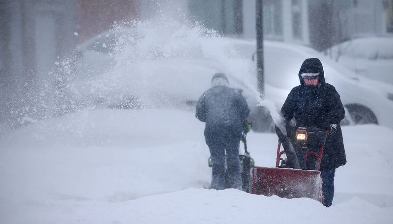 People with snowblowers attempt to tame the snow along Ontario Avenue, Monday, March 16, 2026, in Sheboygan, Wis.
