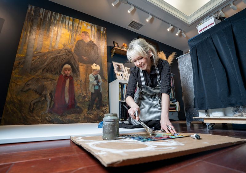 Sasha Kinens, The Pfister Hotel’s 16th artist in residence, applies a base layer to a painting in the hotel's Artist in Residence Studio, a working studio and gallery open to the public, on March 12, 2026, in Milwaukee.
