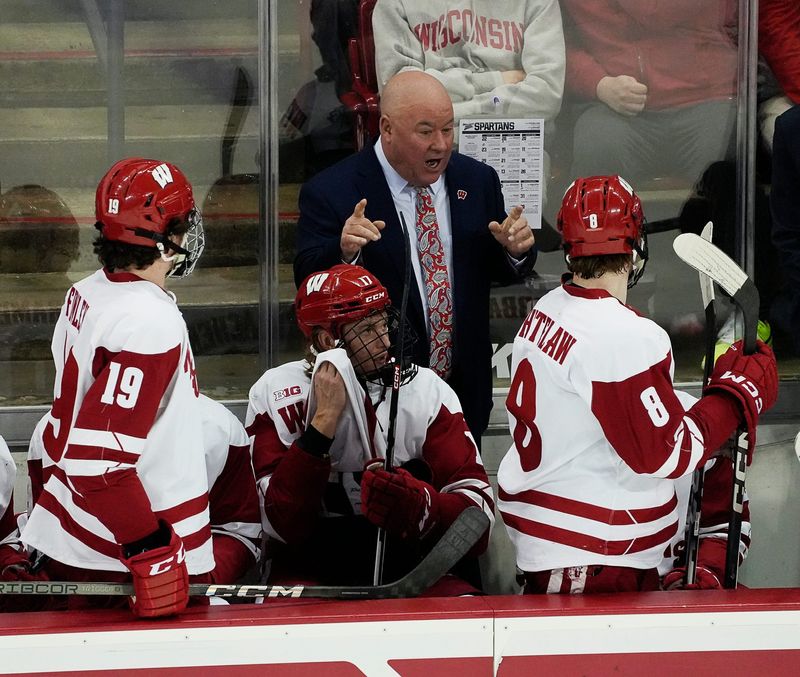 Wisconsin Head Coach Mike Hastings speaks to forward William Whitelaw (8) during the second period of the match against Michigan St. on Saturday March 2, 2024 at the Kohl Center in Madison, Wis.