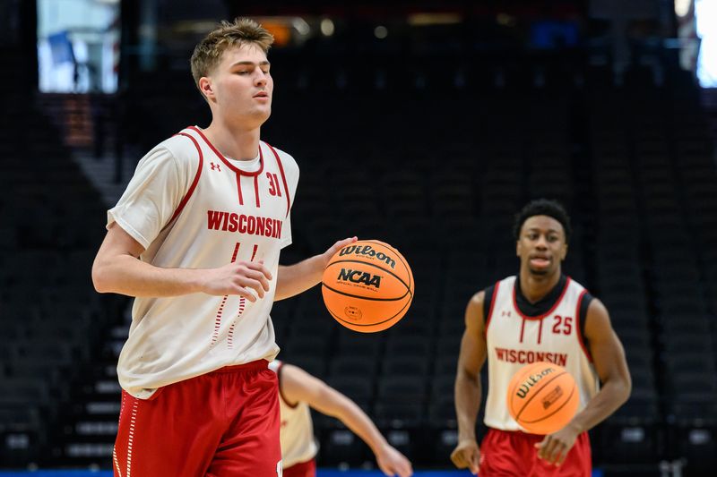 Mar 18, 2026; Portland, OR, USA; Wisconsin Badgers forward Nolan Winter (31) dribbles the ball during a practice session ahead of the first round of the men's 2026 NCAA Tournament at Moda Center. Mandatory Credit: Craig Strobeck-Imagn Images