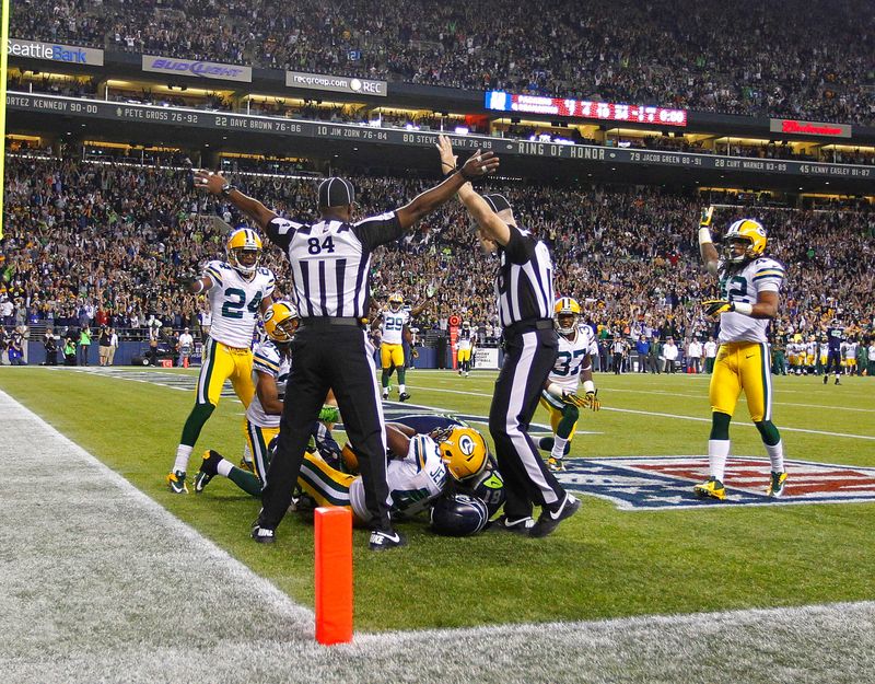 Officials indicate opposite rulings, one a touchdown, one incomplete in the 14-12 loss to the Seattle Seahawks during the "Monday Night Football" game in Seattle, Monday, Sept. 24, 2012.