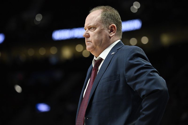 Mar 19, 2026; Portland, OR, USA; Wisconsin Badgers head coach Greg Gard reacts during the first half of a first round game of the men's 2026 NCAA Tournament against the High Point Panthers at Moda Center. Mandatory Credit: Troy Wayrynen-Imagn Images
