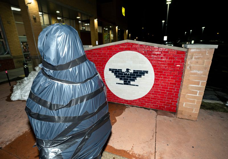 The Cesar Chavez statue along South Cesar Chavez Drive is seen covered with plastic, where it is set to be removed following allegations of sexual abuse against the late labor leader, on Thursday March 19, 2026 in Milwaukee, Wisconsin.