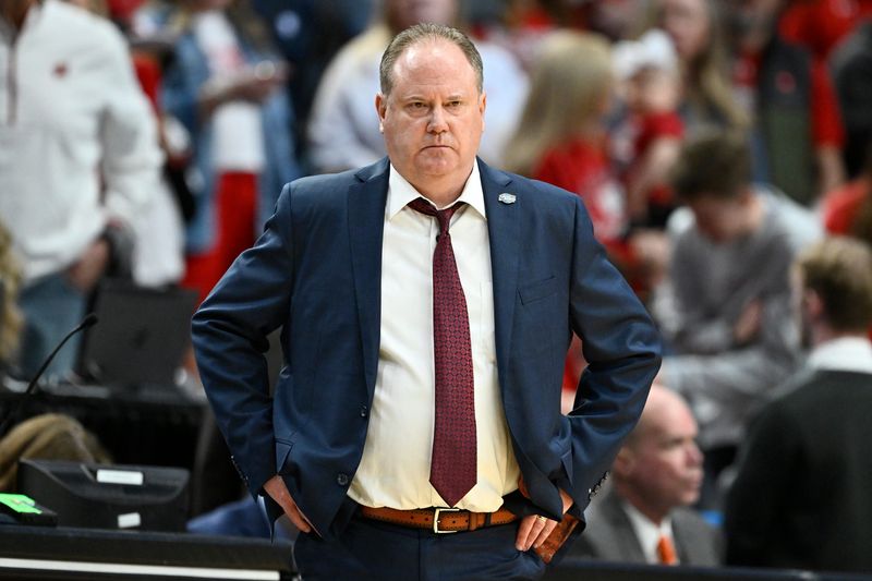 Mar 19, 2026; Portland, OR, USA; Wisconsin Badgers head coach Greg Gard reacts during the second half of a first round game of the men's 2026 NCAA Tournament against the High Point Panthers at Moda Center. Mandatory Credit: Craig Strobeck-Imagn Images