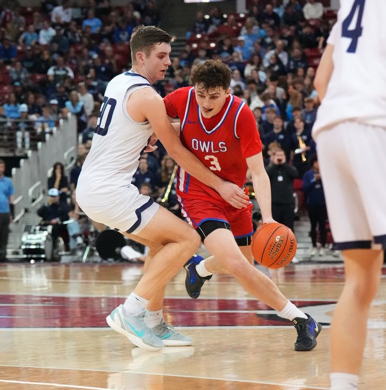 Slinger's Jack Kohnen (3) breaks for the paint against McFarland's Eli Krueger (20) during their WIAA Division 2 state semifinal basketball game on Friday, March 20, 2026, at the Kohl Center in Madison, Wisconsin. Slinger won the game, 83-56.