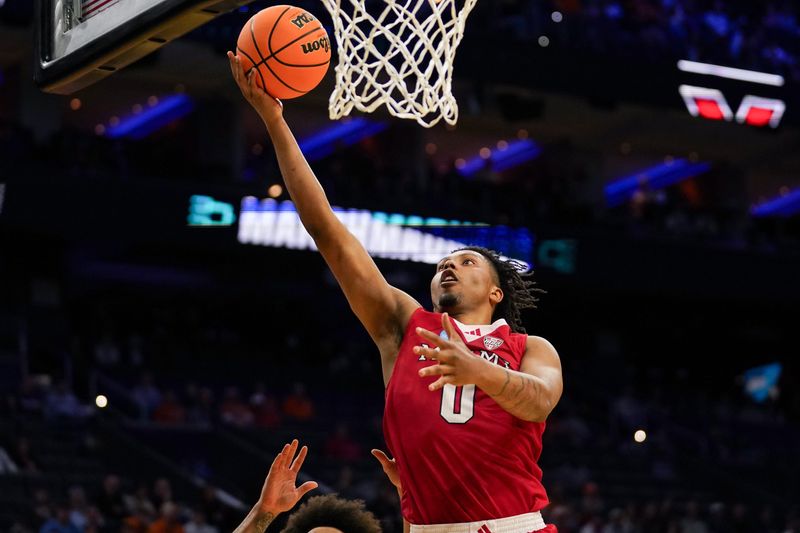 Miami (Ohio) wing Eian Elmer scores on a layup against Tennessee.