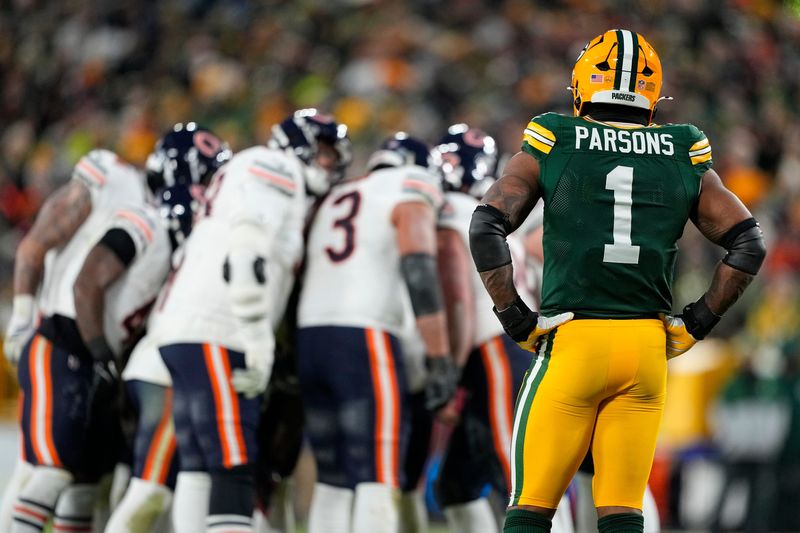 Dec 7, 2025; Green Bay, Wisconsin, USA; Green Bay Packers defensive end Micah Parsons (1) looks on during the game against the Chicago Bears at Lambeau Field. Mandatory Credit: Jeff Hanisch-Imagn Images