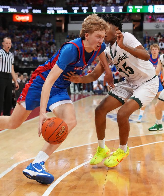 Wisconsin Lutheran's Kager Knueppel (1) breaks past Madison Memorial's Lavonte Johnson (15) during the WIAA Division 1 boys state championship basketball game on Saturday, March 21, 2026, at the Kohl Center in Madison, Wisconsin.