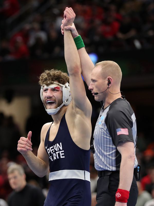 Penn State’s Mitchell Mesenbrink celebrates after beating Iowa’s Mikey Caliendo in the 165 pound finals match in the NCAA Division I wrestling championships at Rocket Arena, March 21, 2026, in Cleveland, Ohio.