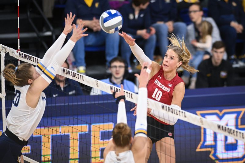 Wisconsin outside hitter Madison Quest (10) attacks against Marquette in a spring match Monday, March 23, 2026, at the Al McGuire Center in Milwaukee, Wisconsin.