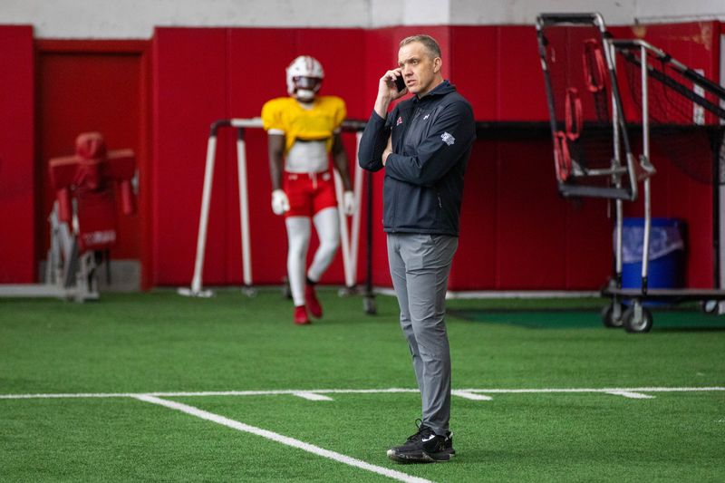Wisconsin athletic director Chris McIntosh takes a phone call while watching a spring practice at the McClain Center in Madison on March 24, 2026.
