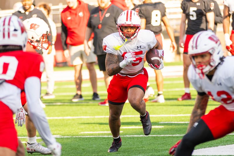 Wisconsin Badgers running back Nate Palmer carries the ball during a spring practice at Camp Randall Stadium in Madison on March 26, 2026.