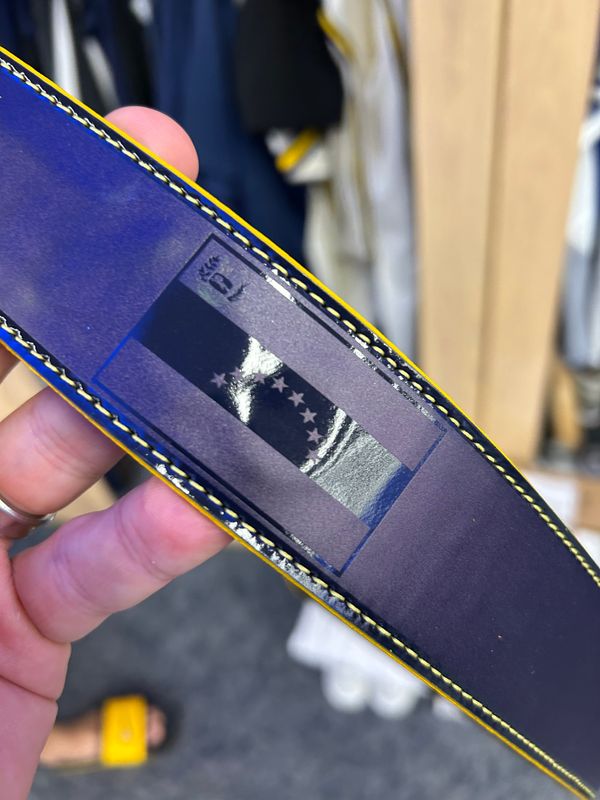 The Venezuelan flag is shown on William Contreras' belt, an opening day gift from Brandon Woodruff
