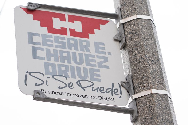 A sign notating the Cesar E. Chavez Drive Business Improvement District is displayed on César E. Chávez Drive on March 18, 2026, in Milwaukee, Wisconsin. - Angelica Edwards / The Milwaukee Journal Sentinel