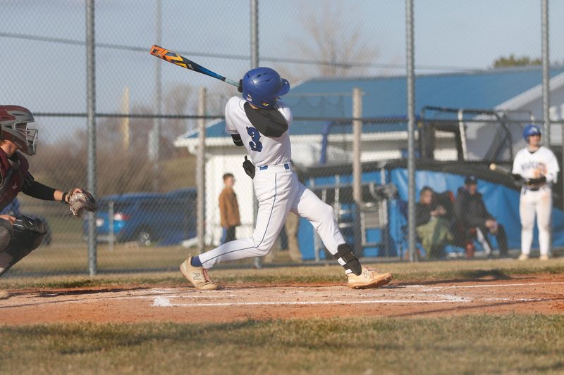 Oshkosh West's Noah Muehrer swings the bat against Winneconne at Peppler Field in Oshkosh on Tuesday, March 31, 2026. Winneconne won the game, 5-4.