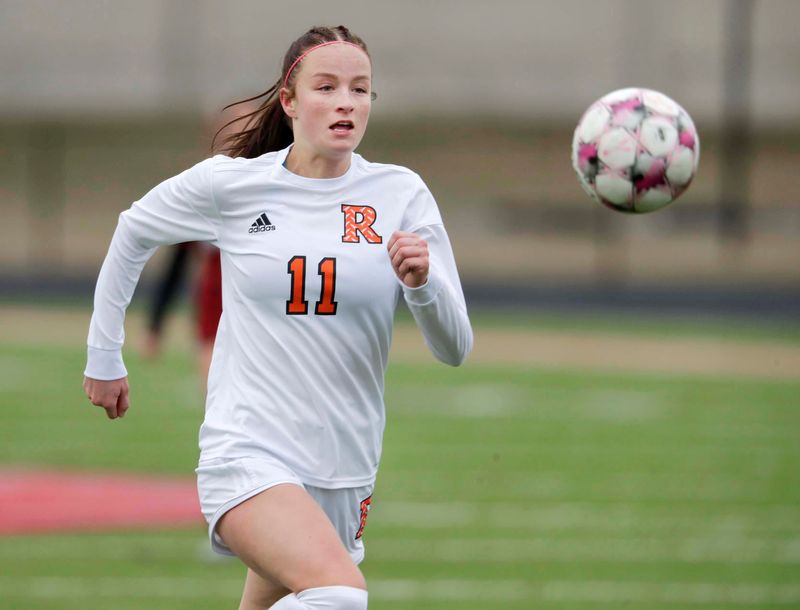Cedar Grove-Belgium’s Arden Getschman (11) eyes the ball against Manitowoc Lincoln at Ron Rubick Field, Tuesday, March 31, 2026, in Manitowoc, Wis.