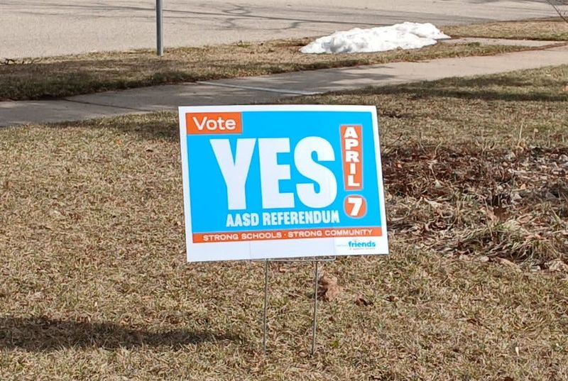 A yard sign posted in the neighborhood of Appleton West High School encourages residents to vote in favor of Appleton schools' operational referendum.