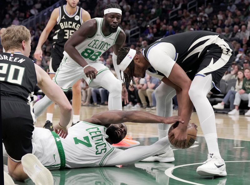Bucks center Myles Turner and Celtics guard Jaylen Brown (7) vie for a loose ball during the first the first half on Friday, April 3, at Fiserv Forum in Milwaukee.



Mark Hoffman/Milwaukee Journal Sentinel