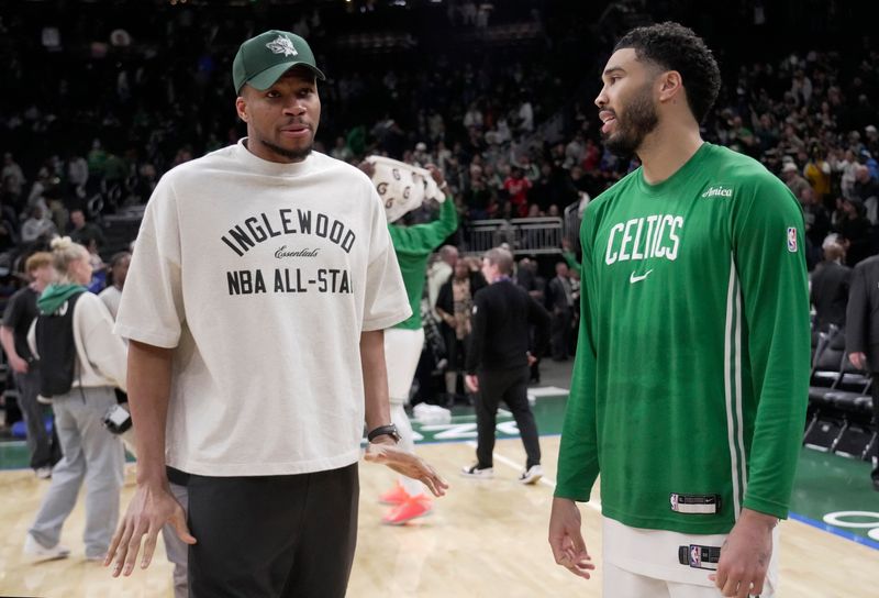 Milwaukee Bucks forward Giannis Antetokounmpo, left, talks with Boston Celtics forward Jayson Tatum after their game Friday, April 3, 2026 at Fiserv Forum in Milwaukee, Wisconsin. The Boston Celtics beat the Milwaukee Bucks 133-101.