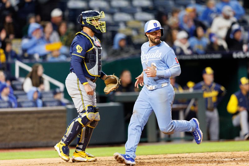 Royals second baseman Jonathan India scores past Brewers catcher Gary Sanchez during the sixth inning of the second game of a doubleheader April 4 at Kauffman Stadium.