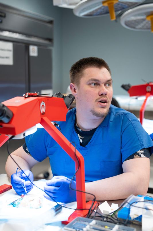 Ukrainian surgeon Maks Makarenkov learns microsurgery techniques at the UW Microsurgery Regenerative Medicine Lab in Madison the afternoon of April 2. The plastic surgery division hosted six Ukrainian frontline trauma surgeons for a two-week intensive training.